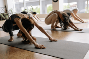 Colleagues practising yoga