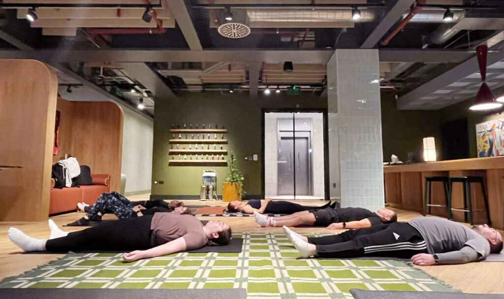 Post-Pilates relaxation for office team